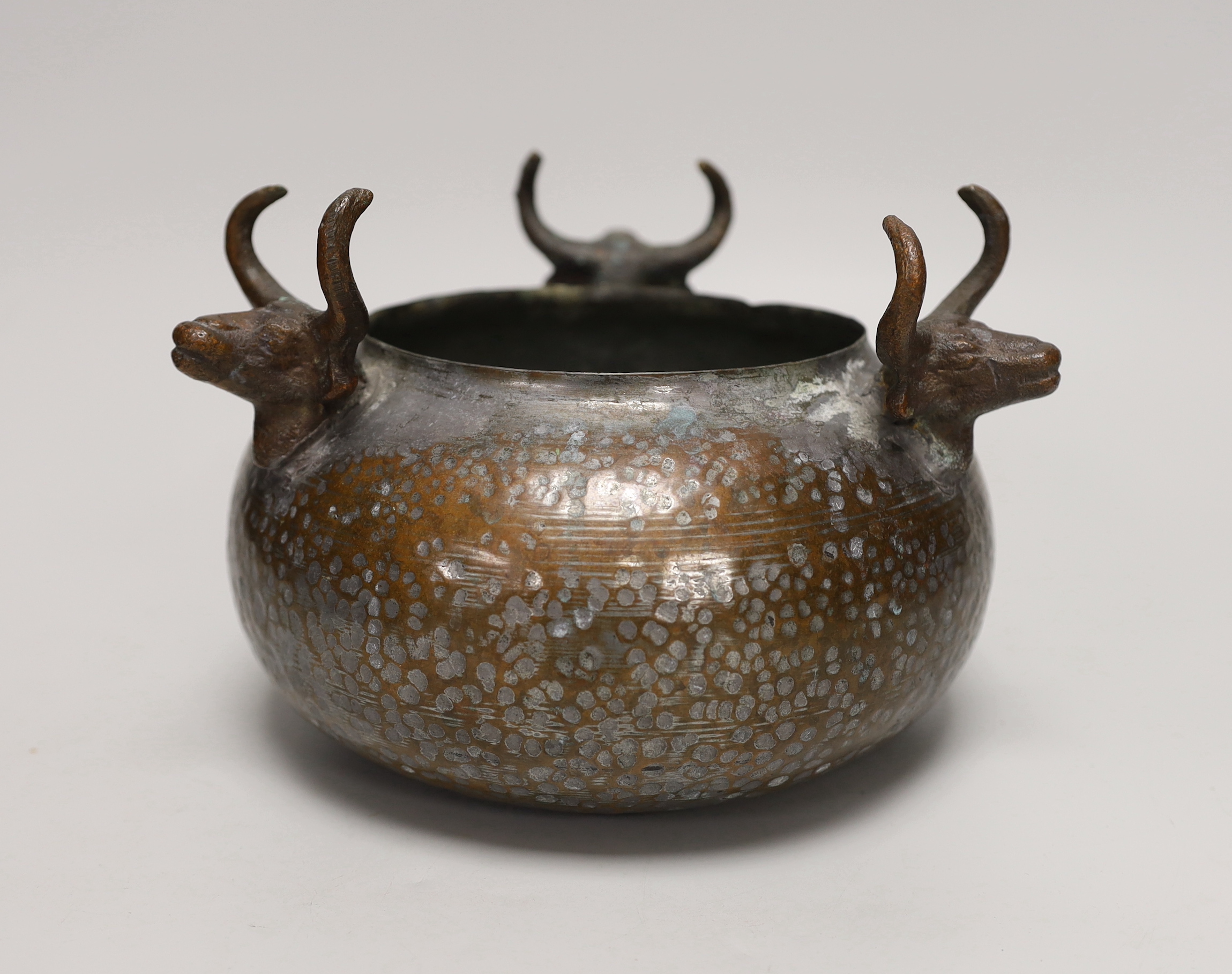 An Indian planished copper jardiniere, 15cm tall